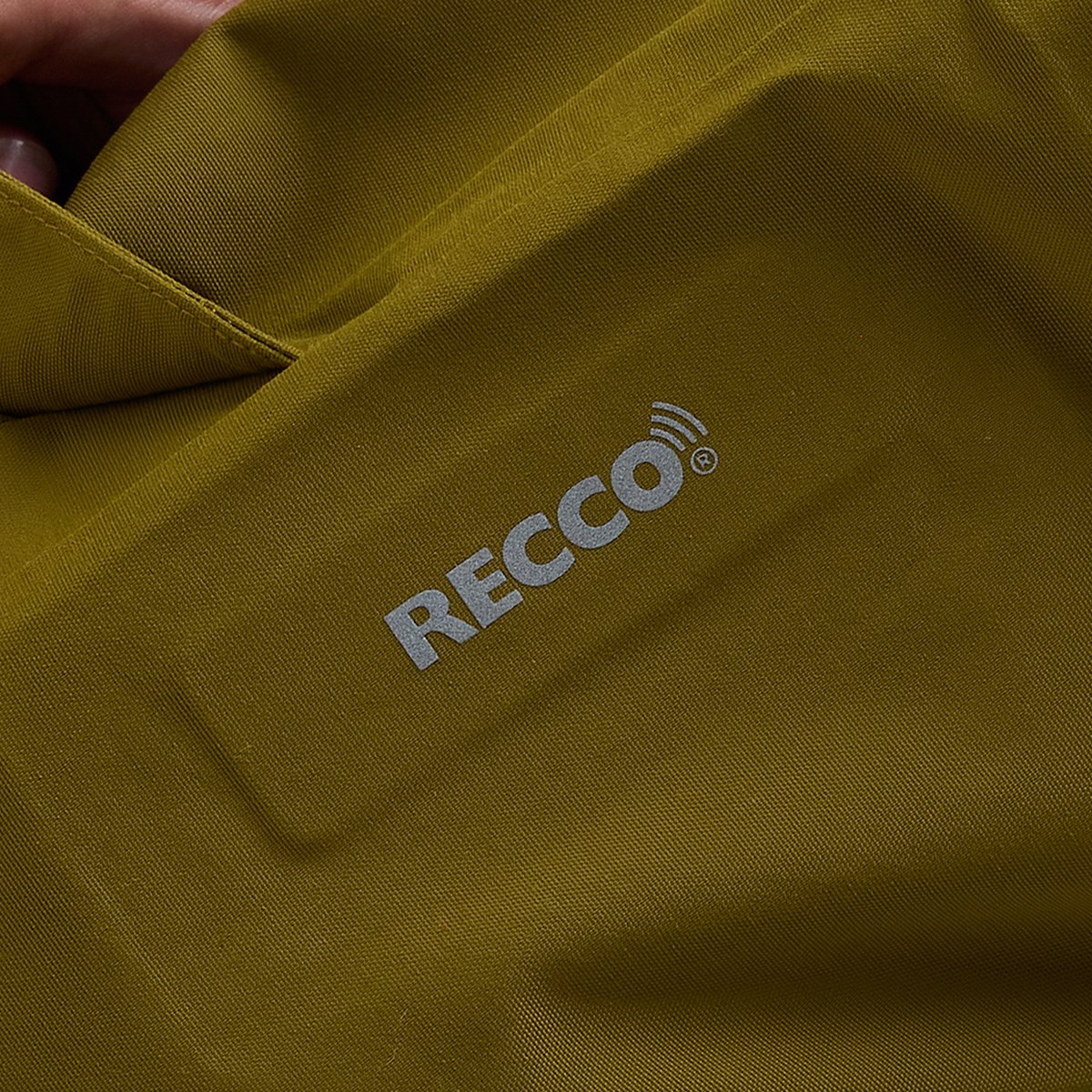 Recco locator integrated into bib pant fabric.