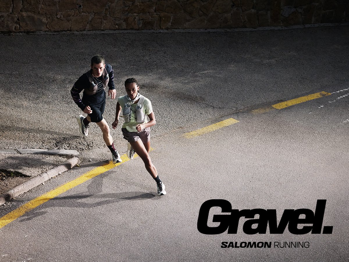 Two runners transitioning frm gravel to paved road with "Gravel" logo overlay.