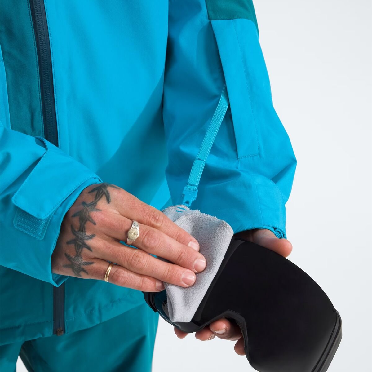 Person using goggle wipe.