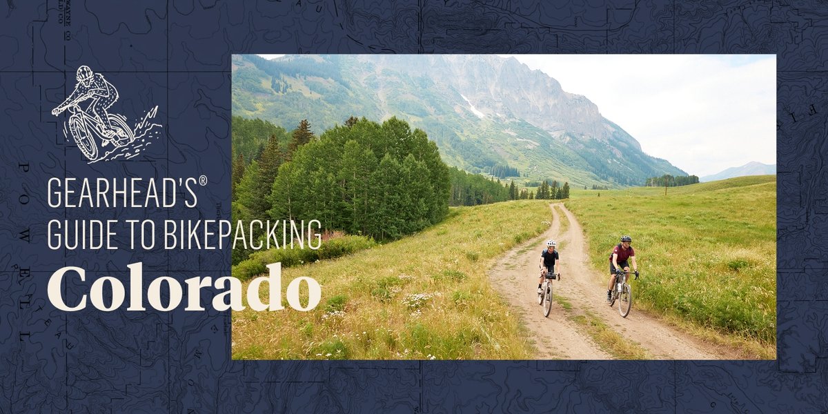 Two bikepackers ride a gravel trail. Text overlay reads: Gearhead’s Guide To Bikepacking Colorado.
