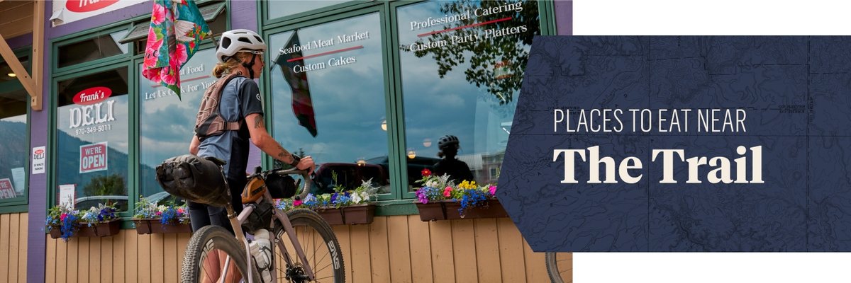 A biker stop for lunch. The text overlay reads: Places to eat near the trail.