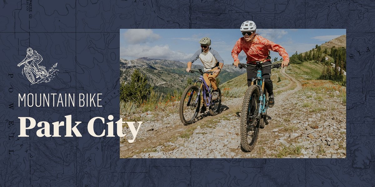 Two mountain bikers ride a single track trail mountain bikes. There is a topographic frame around the image. Text overlay reads: Mountain Bike Park City