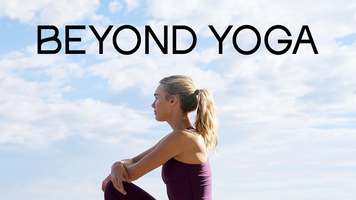 Woman in purple athletic wear sitting outdoors against a blue sky with "Beyond Yoga" text, demonstrating yoga apparel for active lifestyle.