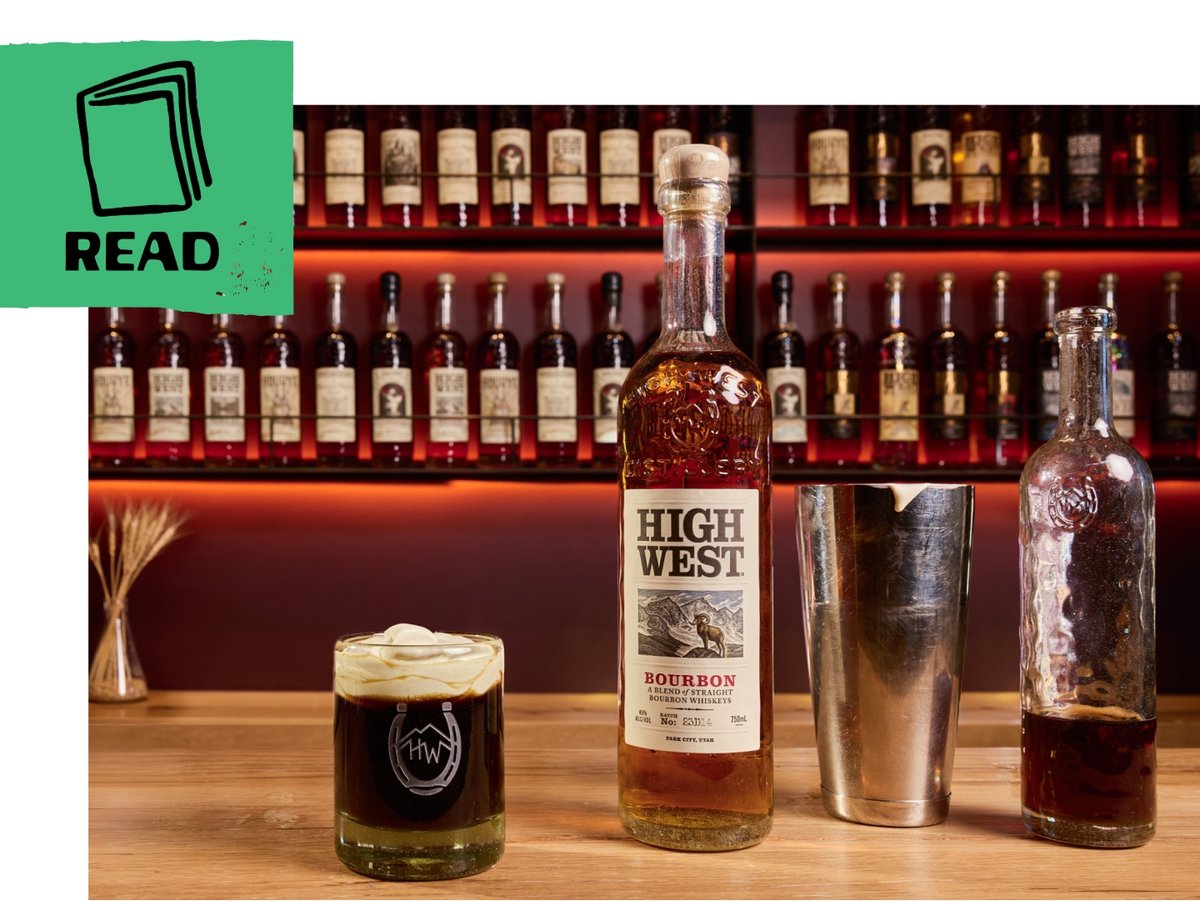 A bar countertop displays a glass of coffee cocktail topped with cream, a bottle of High West Bourbon, and a cocktail shaker. A green flag includes an illustration of a book and the word “read.”