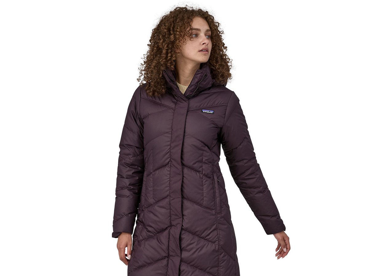 A full-body shot of a woman wearing the Down With It Parka