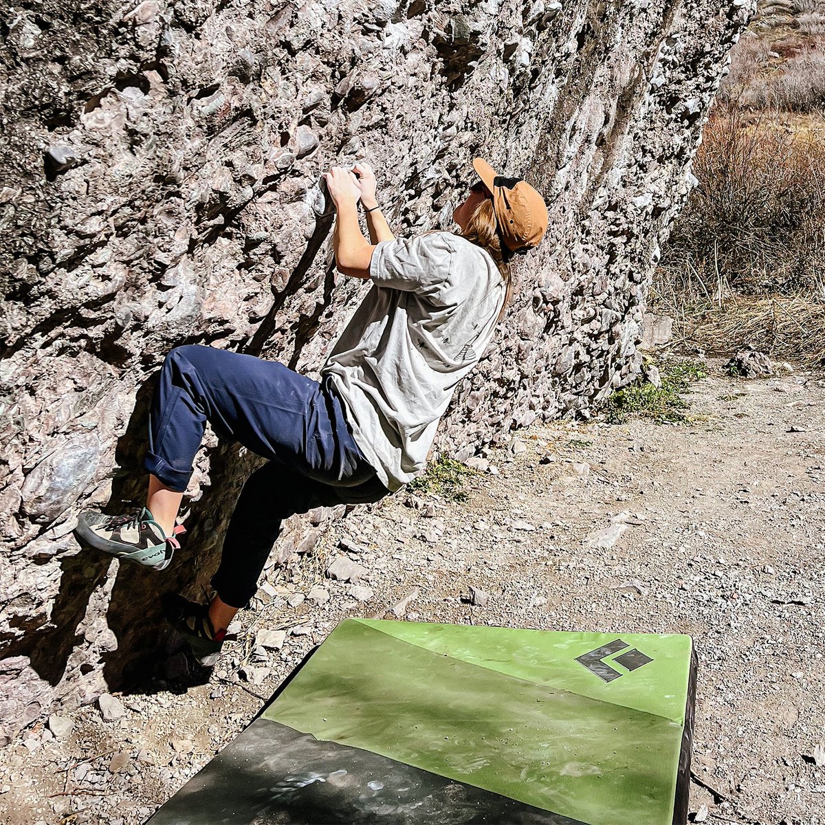 Climber bouldering while wearing Coalatree workwear hat.