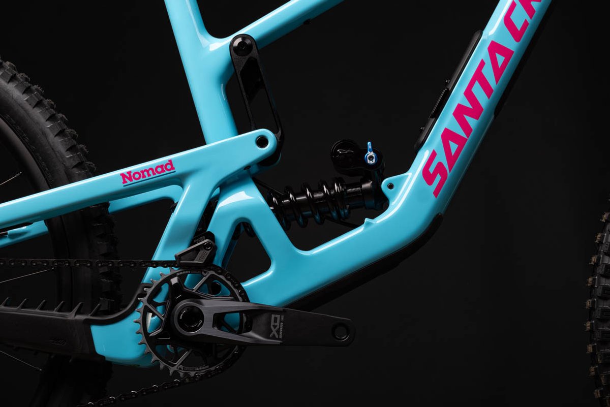 Santa Cruz Nomad VPP suspension linkage detail with coil shock and SRAM X0 crankset on teal carbon enduro mountain bike frame
