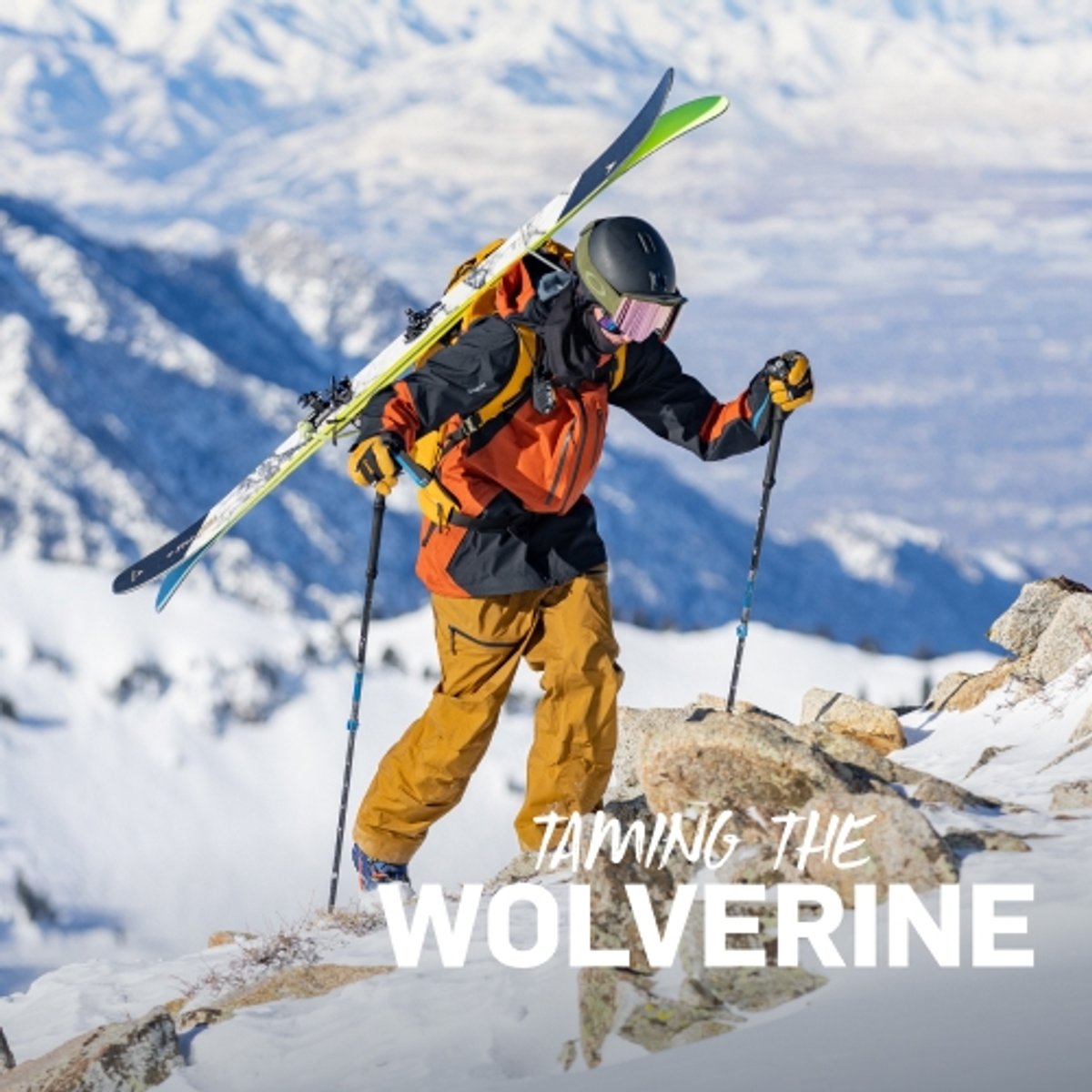 A skier hikes up a mountain with his skis attached to his backpack. 