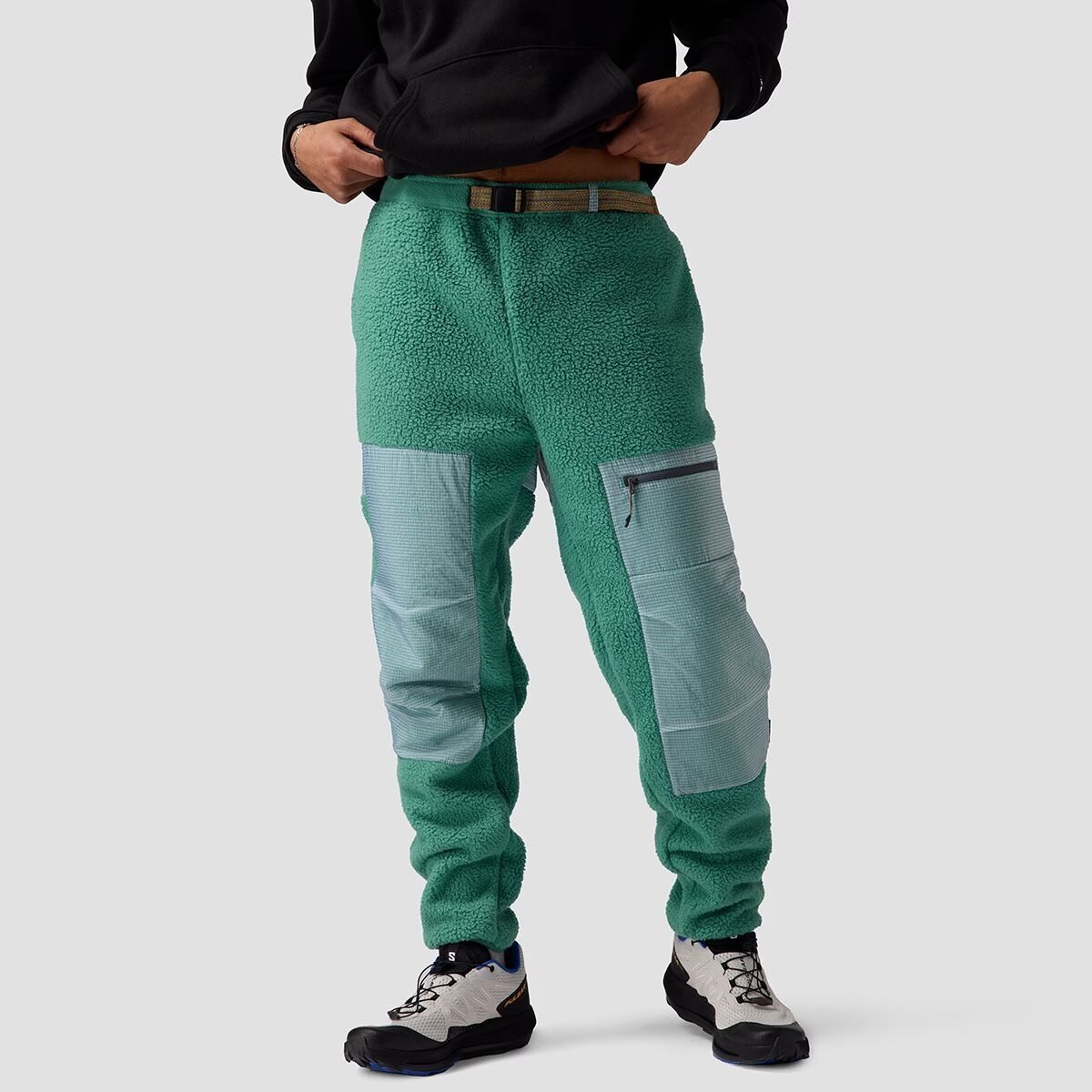 A man wears the BGA Wander Pile Fleece Pant