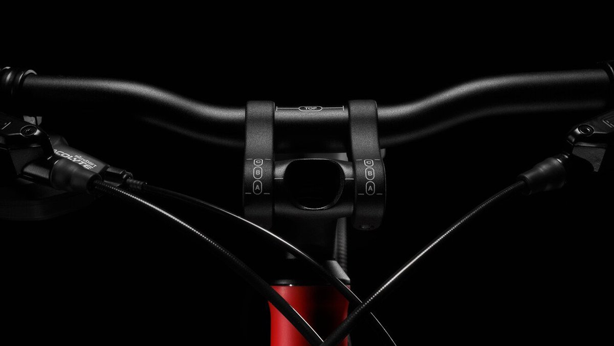 Detail shot of Woom Explore bike handlebar adjustment markers.