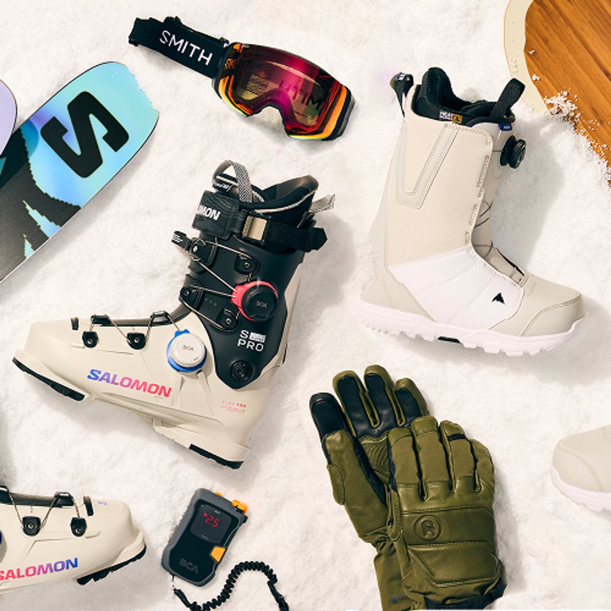 Colorful children’s ski boots arranged on a snowy backdrop.