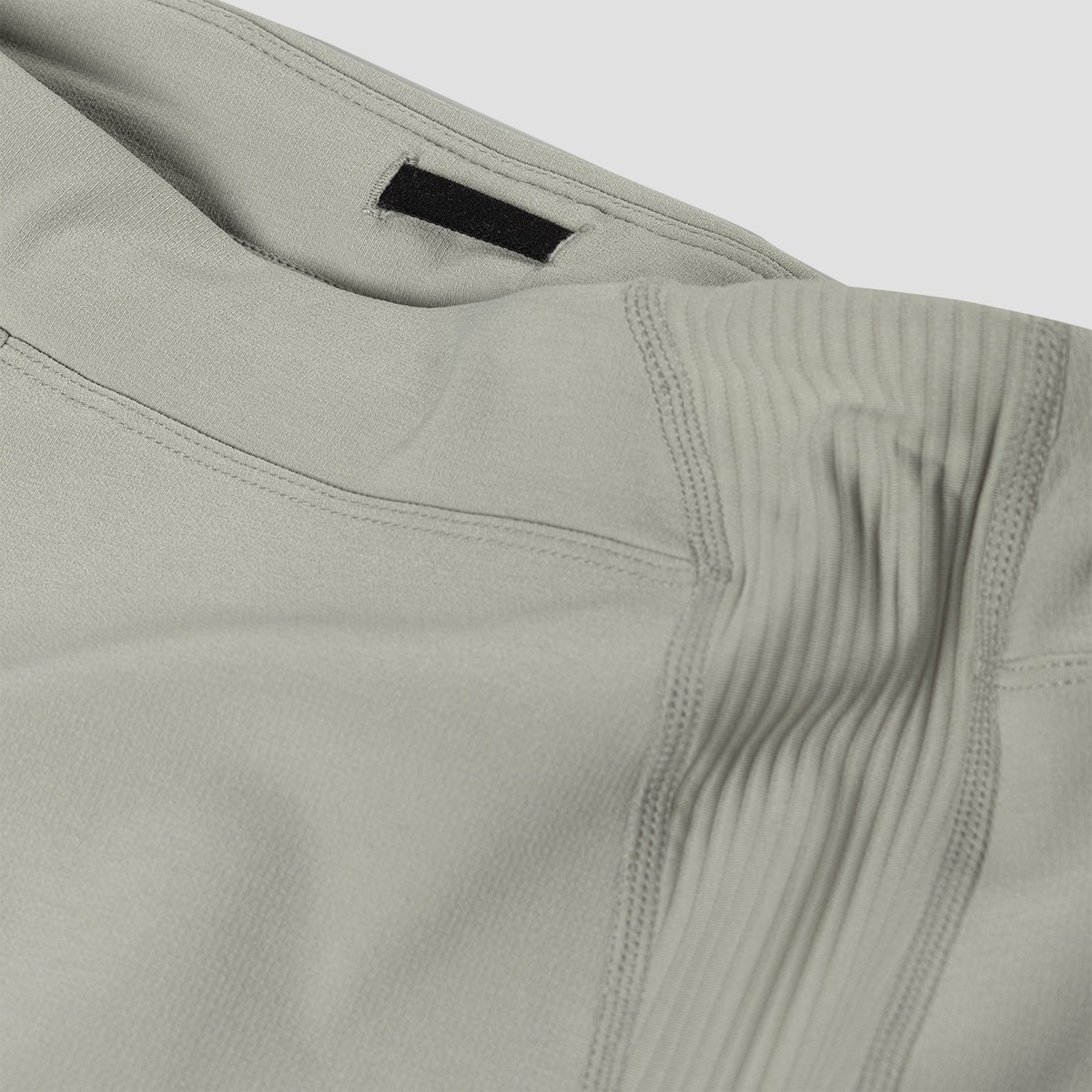 A man wearing the Destination Softshell lifts his arm, highlighting the ripstop fabric and flexible movement.