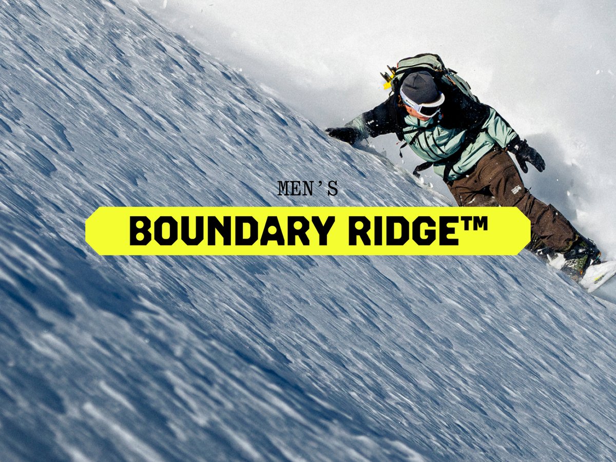 Skiers pop a heely in deep snow. 