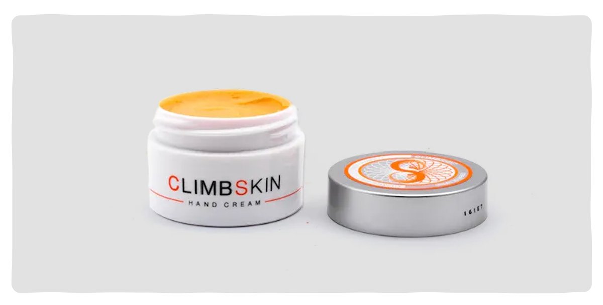 A small tub of orange hand cream.