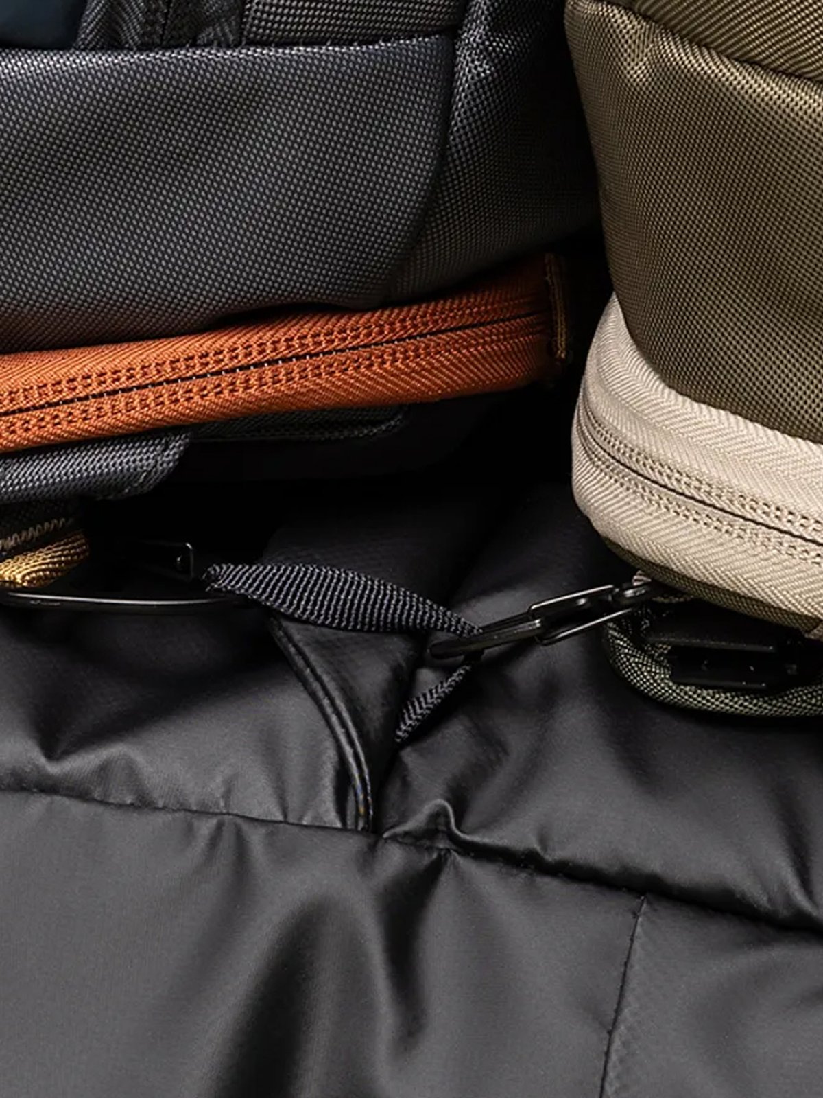 Detail shot of two bags clipped into same webbing loop.