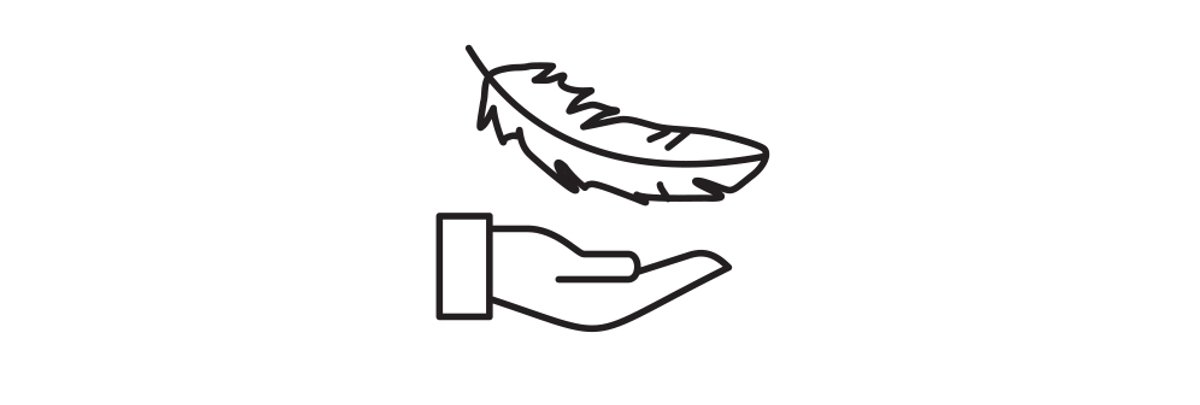 A hand is outreached to catch a feather floating down.