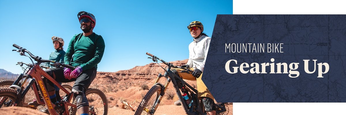 Three people sit on mountain bikes in the desert. Text overlay reads: Mountain Bike Gearing Up